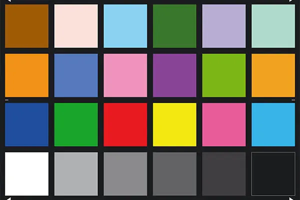 A color checker chart with 24 distinct squares of various colors and grayscale shades, used for standardized camera testing