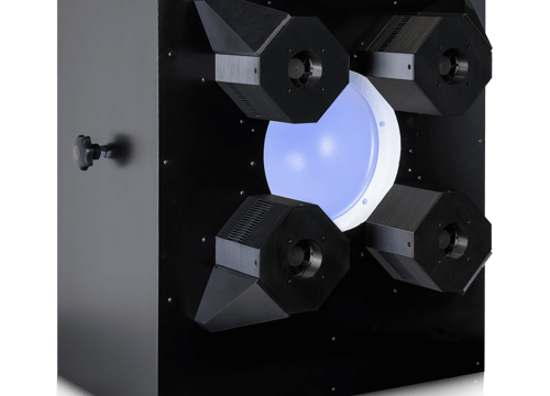 A black box with a central glowing blue circular light source surrounded by four directional narrow band light fixtures