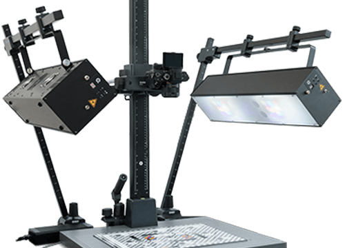Two black narrow band light sources, one angled and one flat, illuminate a white grid on a gray base